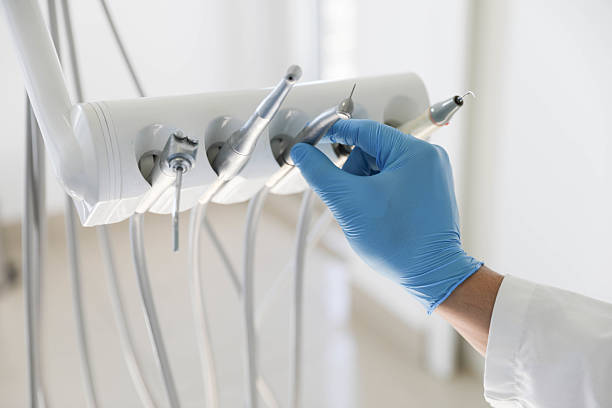 Professional Tooth Extraction technician working in The Woodlands, TX